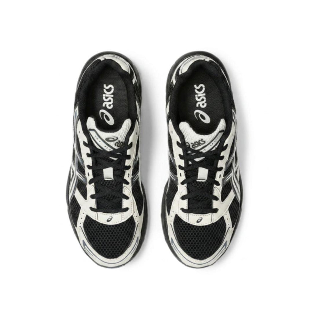 A pair of ASICS sneakers shown from a top-down view, featuring a black and white color-blocked design with mesh and synthetic overlays.