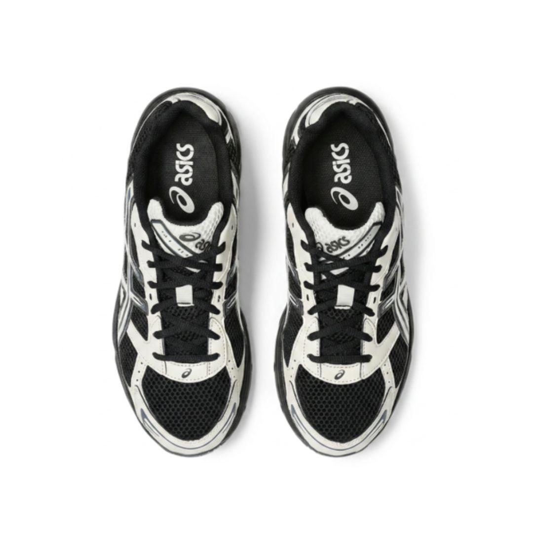A pair of ASICS sneakers shown from a top-down view, featuring a black and white color-blocked design with mesh and synthetic overlays.