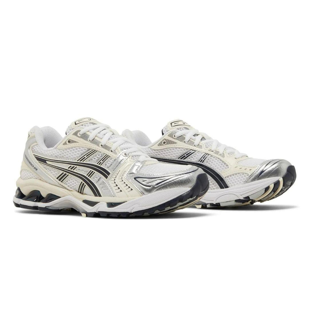 A pair of Asics running shoes in white, silver, and black, shown from a three-quarters angle on a white background.