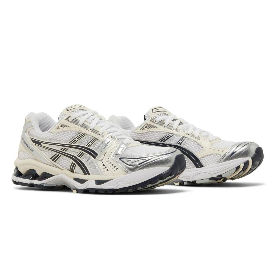 A pair of Asics running shoes in white, silver, and black, shown from a three-quarters angle on a white background.