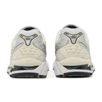 Pair of white running shoes with 'GEL' branding on a white background