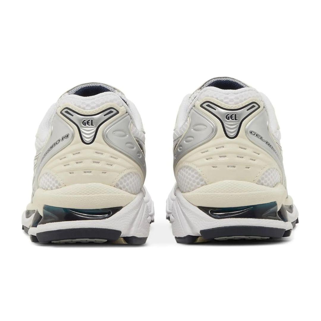 Pair of white running shoes with 'GEL' branding on a white background