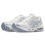 A pair of white and light blue athletic sneakers with silver metallic accents, shown from a three-quarters angle on a white background.