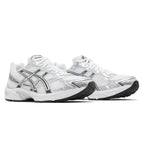 A pair of ASICS athletic sneakers in white, silver, and black, shown from a side profile view against a plain white background.