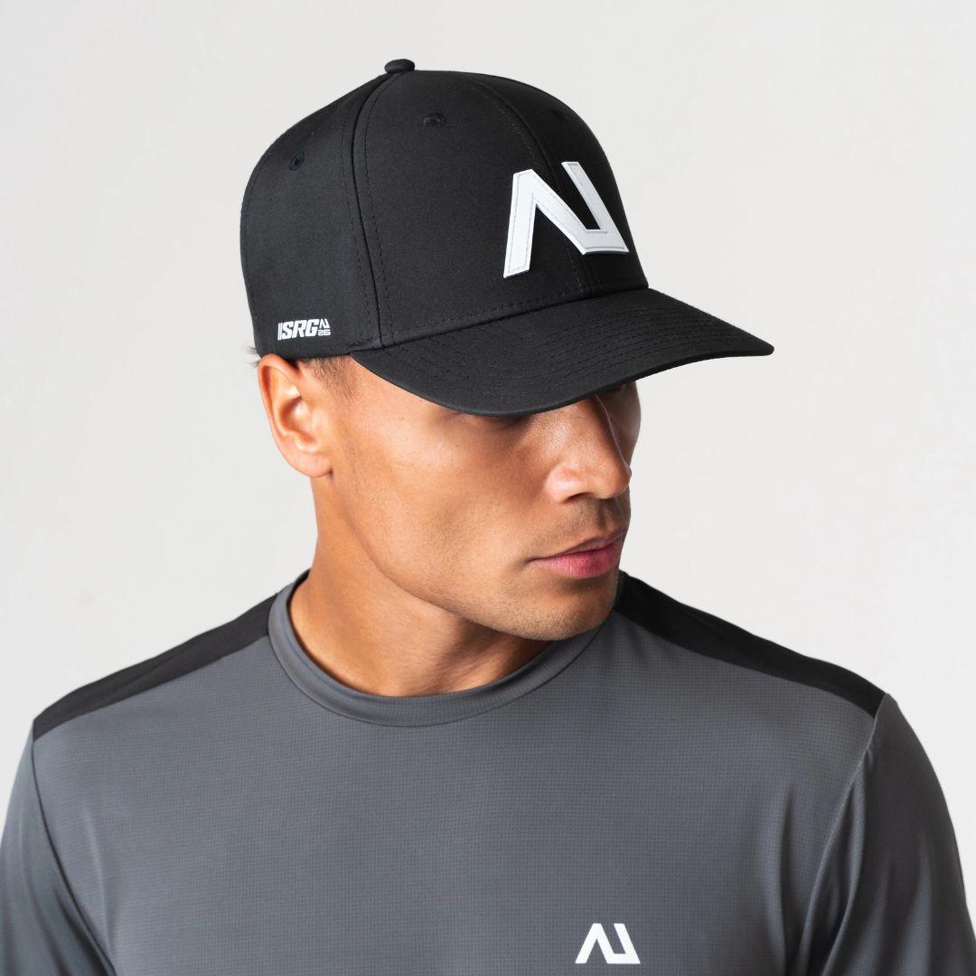 Agaru 'Carbon Black' SRG Cap for men, front view on model of black structured baseball cap with raised Agaru logo badge and SRG side print on the curved brim