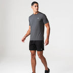 Agaru 'Carbon Black' SRG T-Shirt Set for men, front view on model of charcoal moisture-wicking seamless tee with black shoulder panel and Agaru logo, paired with black woven shorts