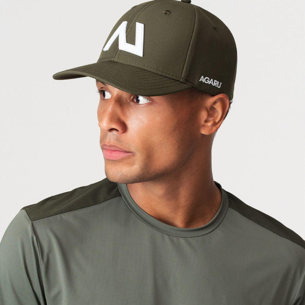 Agaru 'Deep Olive' SRG Cap for men, front three-quarter view on model of the olive structured cap with raised logo badge and curved brim
