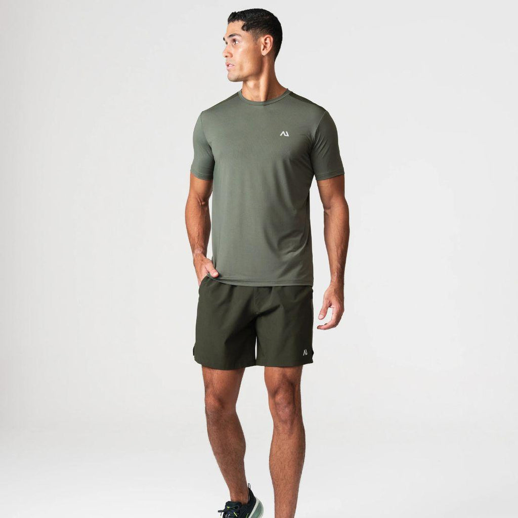 Agaru 'Deep Olive' SRG T-Shirt Set for men, front view on model of olive moisture-wicking seamless tee with Agaru logo and matching dark olive woven shorts
