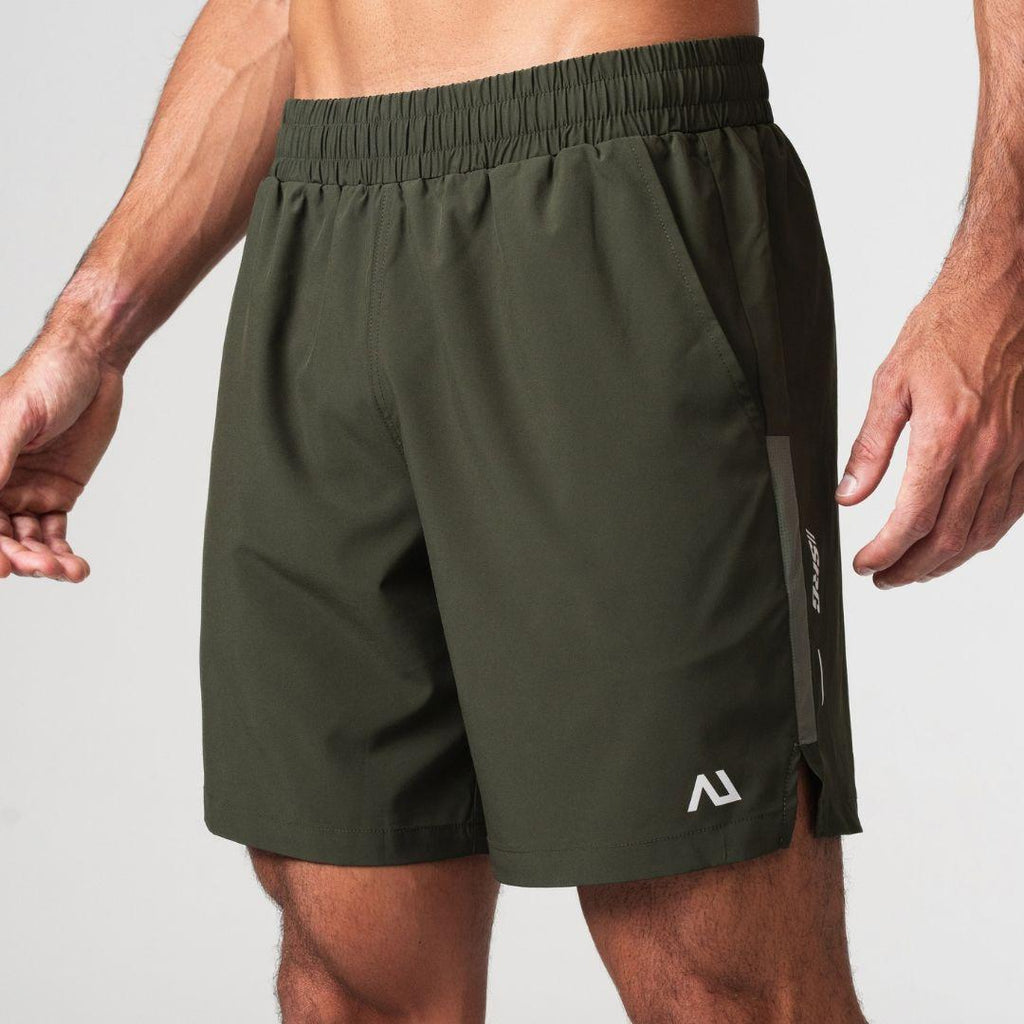 Agaru 'Deep Olive' SRG Shorts for men, front view on model of dark olive woven training shorts with elasticated waistband, side pockets and SRG branding