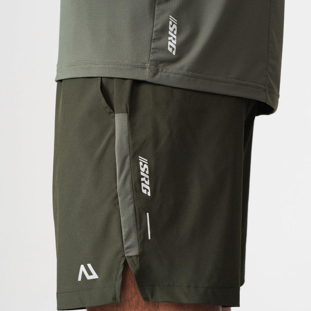 Agaru 'Deep Olive' SRG Shorts for men, close-up of the zipped side pocket, SRG logo print and Agaru branding on the dark olive woven shorts