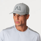 Agaru 'Titanium Grey' SRG Cap for men, front view on model of grey structured baseball cap with tonal Agaru logo badge and Agaru wordmark on the curved brim