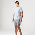 Agaru 'Titanium Grey' SRG T-Shirt Set for men, front view on model of grey moisture-wicking seamless tee with Agaru logo and matching grey woven shorts with zipped side pocket