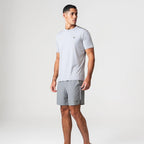 Agaru 'Titanium Grey' SRG T-Shirt Set for men, front view on model of grey moisture-wicking seamless tee with Agaru logo and matching grey woven shorts with zipped side pocket