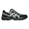 Asics black and grey running shoe on a light gray background