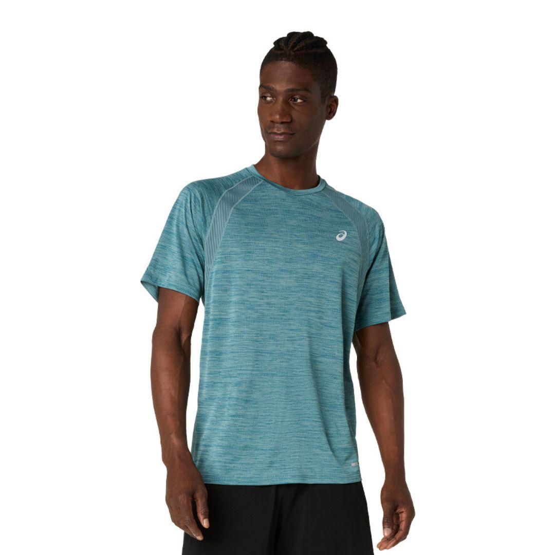 A man wearing a teal heathered athletic t-shirt with a small white Asics logo on the chest, paired with black shorts, against a plain white background.