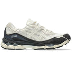 White and black running shoe with Asics logo on a white background