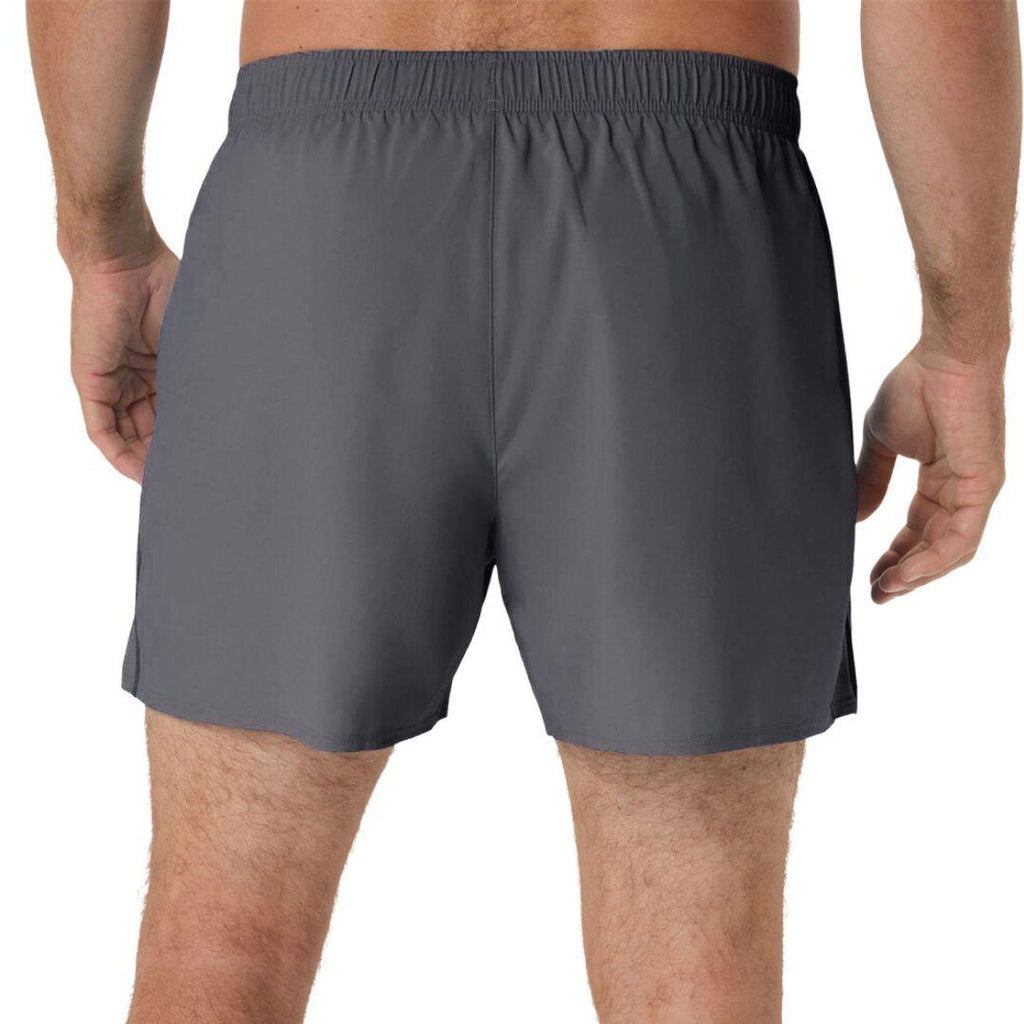 A person wearing dark grey athletic Asics shorts, shown from the back against a plain white background.