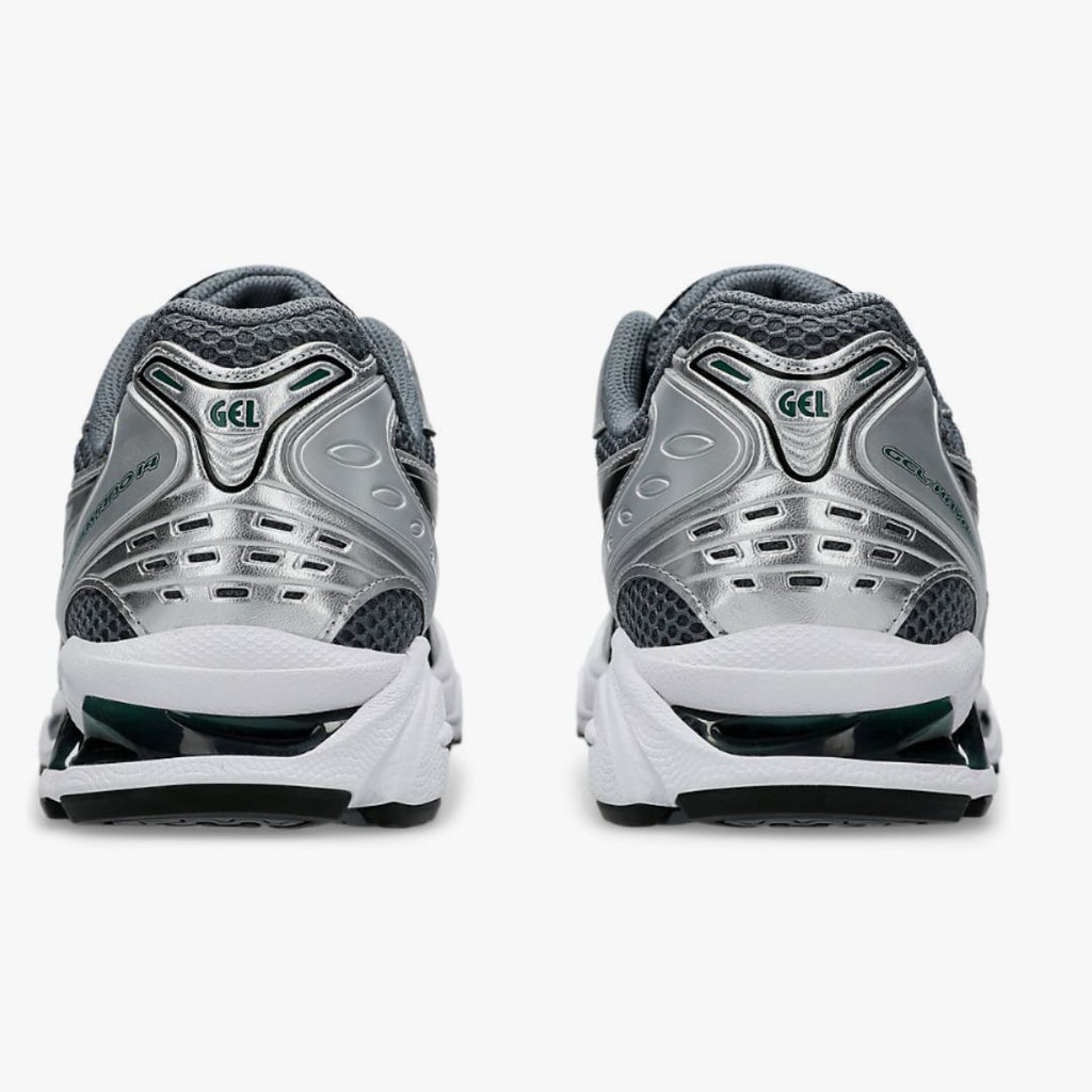 Asics pair of gray and white running shoes with 'GEL' branding on a white background