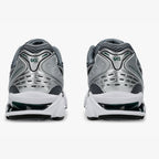 Asics pair of gray and white running shoes with 'GEL' branding on a white background