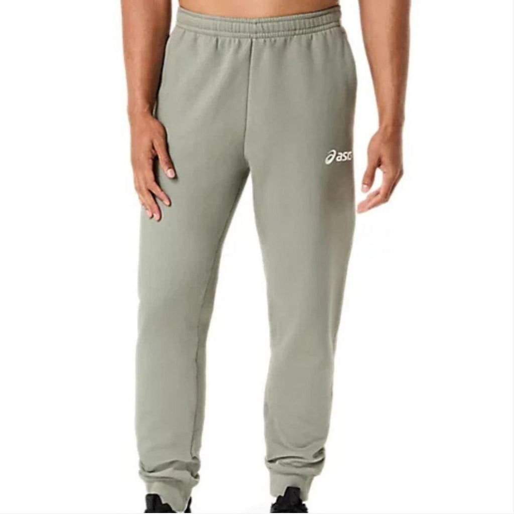 Asics 'Light Green' Fleece Jogger for men, front view on model of light green fleece jogger with elasticated waistband and Asics logo