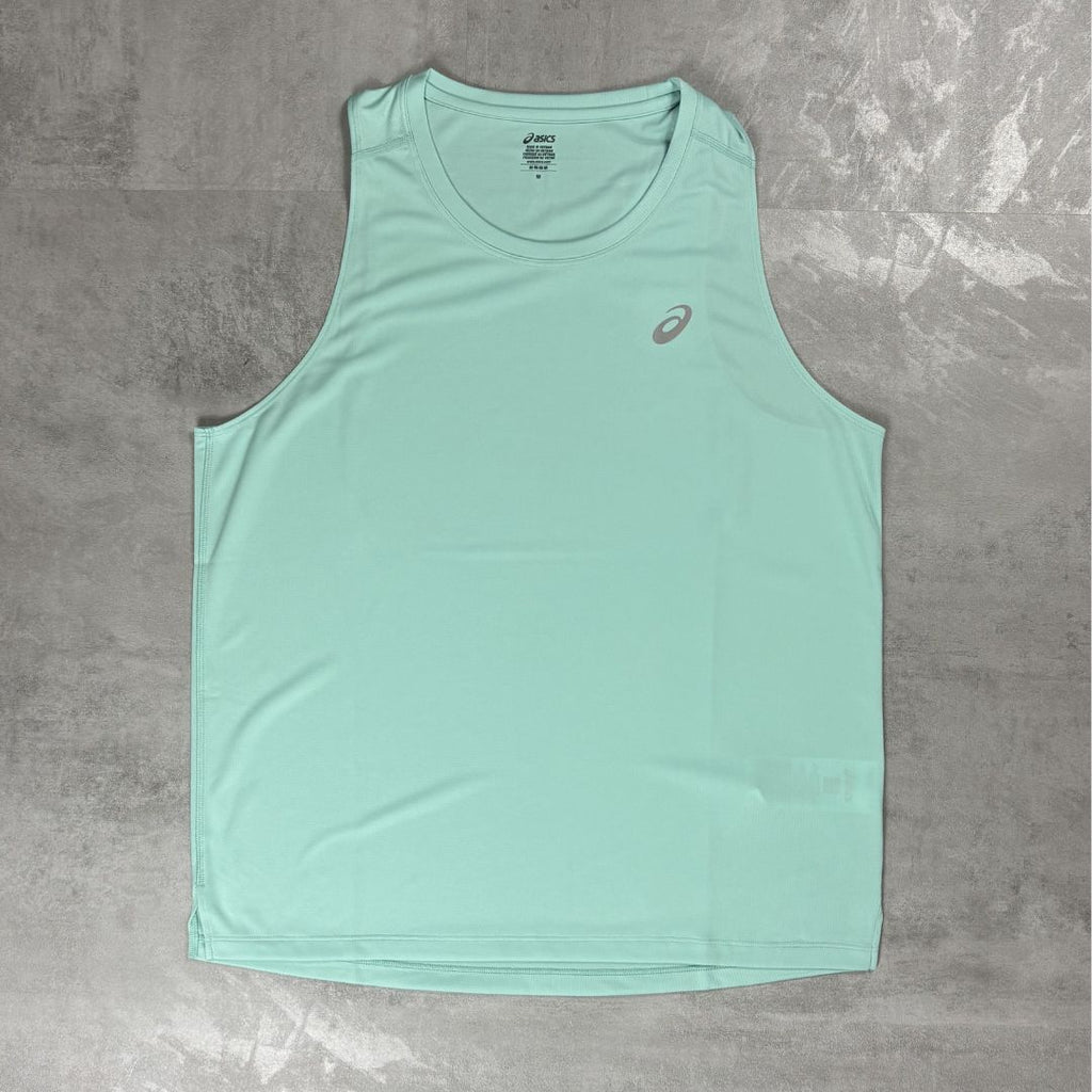 Light blue tank top with a Asics logo on a grey surface
