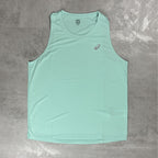 Light blue tank top with a Asics logo on a grey surface