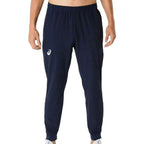 Asics Navy Core Woven Pant for men, front view on model of navy training trouser with elasticated waistband and Asics logo