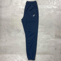 Asics Navy Core Woven Pant for men, flat lay side view of navy training trouser with side pockets, ankle zips and Asics logo