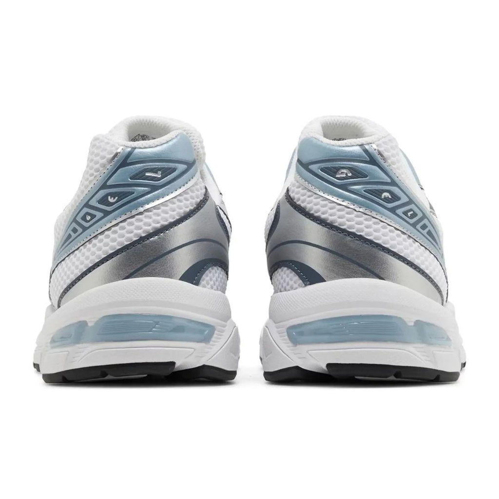 White and blue athletic shoes on a white background