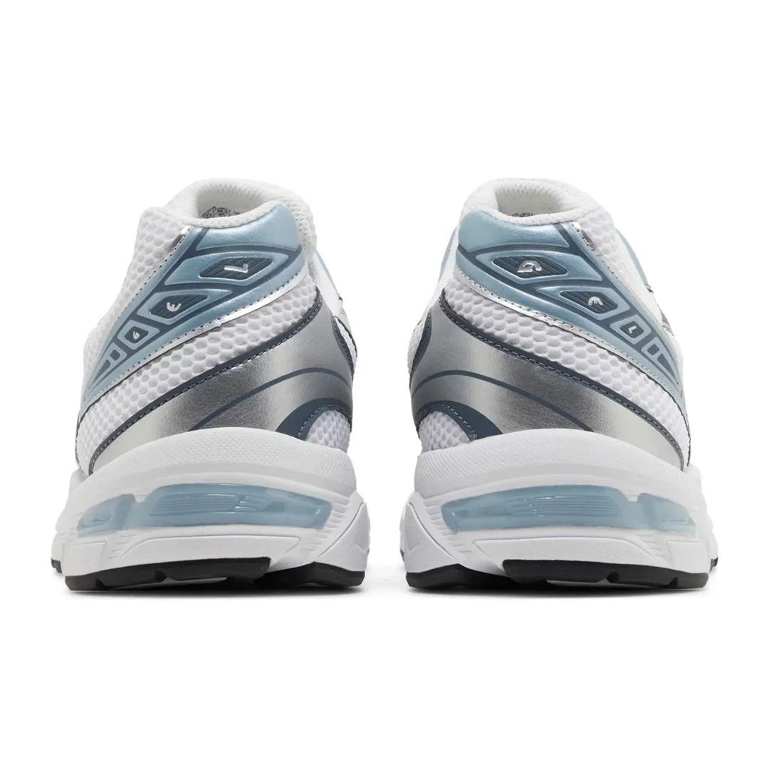 White and blue athletic shoes on a white background
