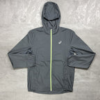 Asics Grey hooded jacket with a zipper on a textured gray background