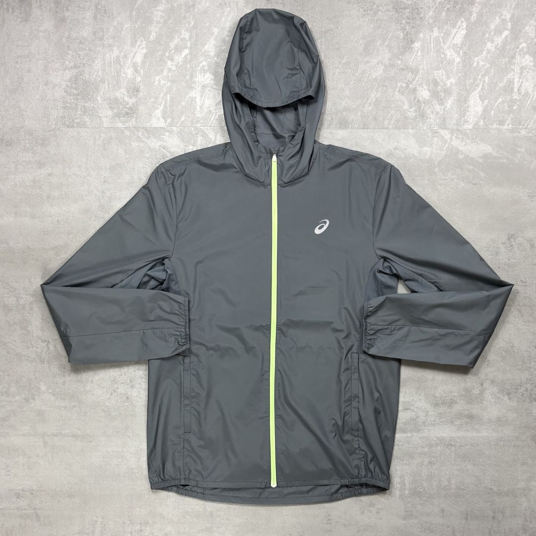 Asics Grey hooded jacket with a zipper on a textured gray background