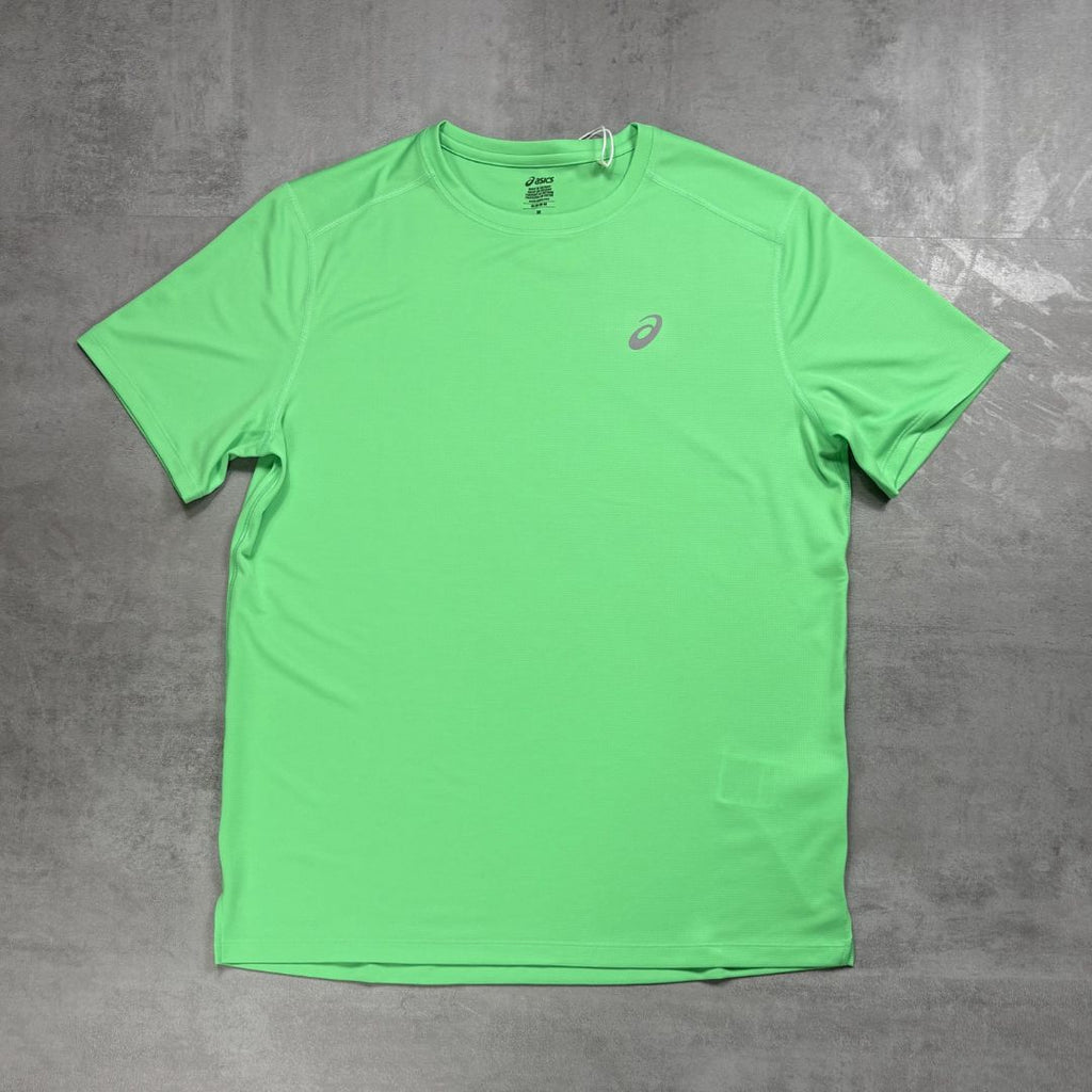 Green t-shirt with a Asics logo on a gray background