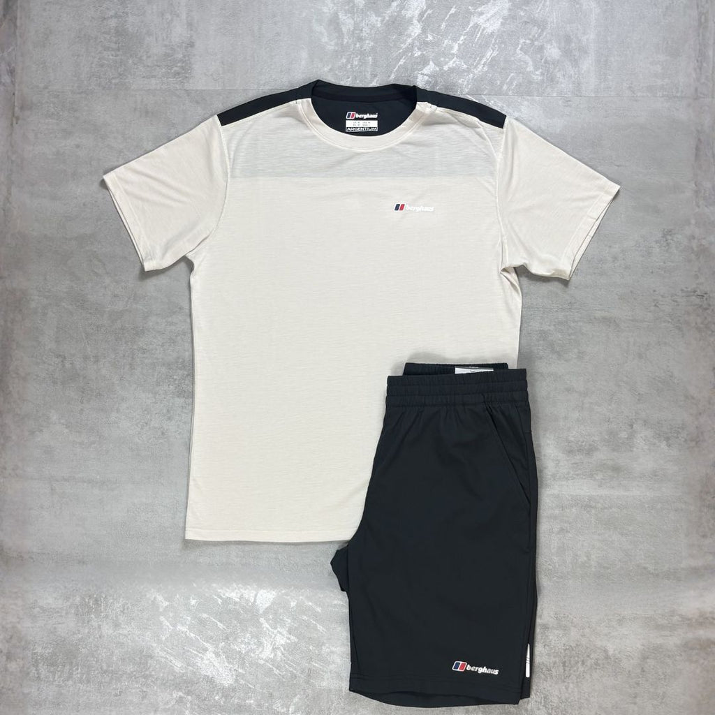 White t-shirt and black shorts with a Berghaus logo on a gray surface