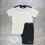 White t-shirt and black shorts with a Berghaus logo on a gray surface