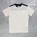 Berghaus White t-shirt with black sleeves on a grey surface