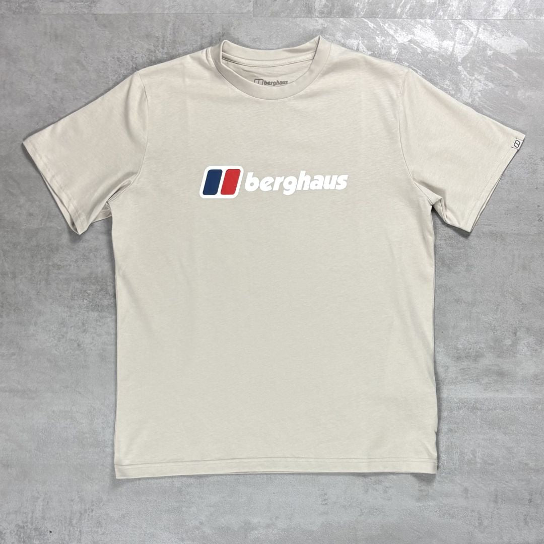 Beige t-shirt with Berghaus logo on a gray background