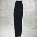 Berghaus Black bottoms layed flat on a grey concrete floor