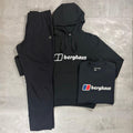 Berghaus Black Logo Hoodie, Tee & Pant Tracksuit for men, flat lay of black brushed fleece pullover hoodie with drawcord hood and Berghaus logo, black crewneck Berghaus logo t-shirt, and matching black joggers with elasticated waistband and patch pocket