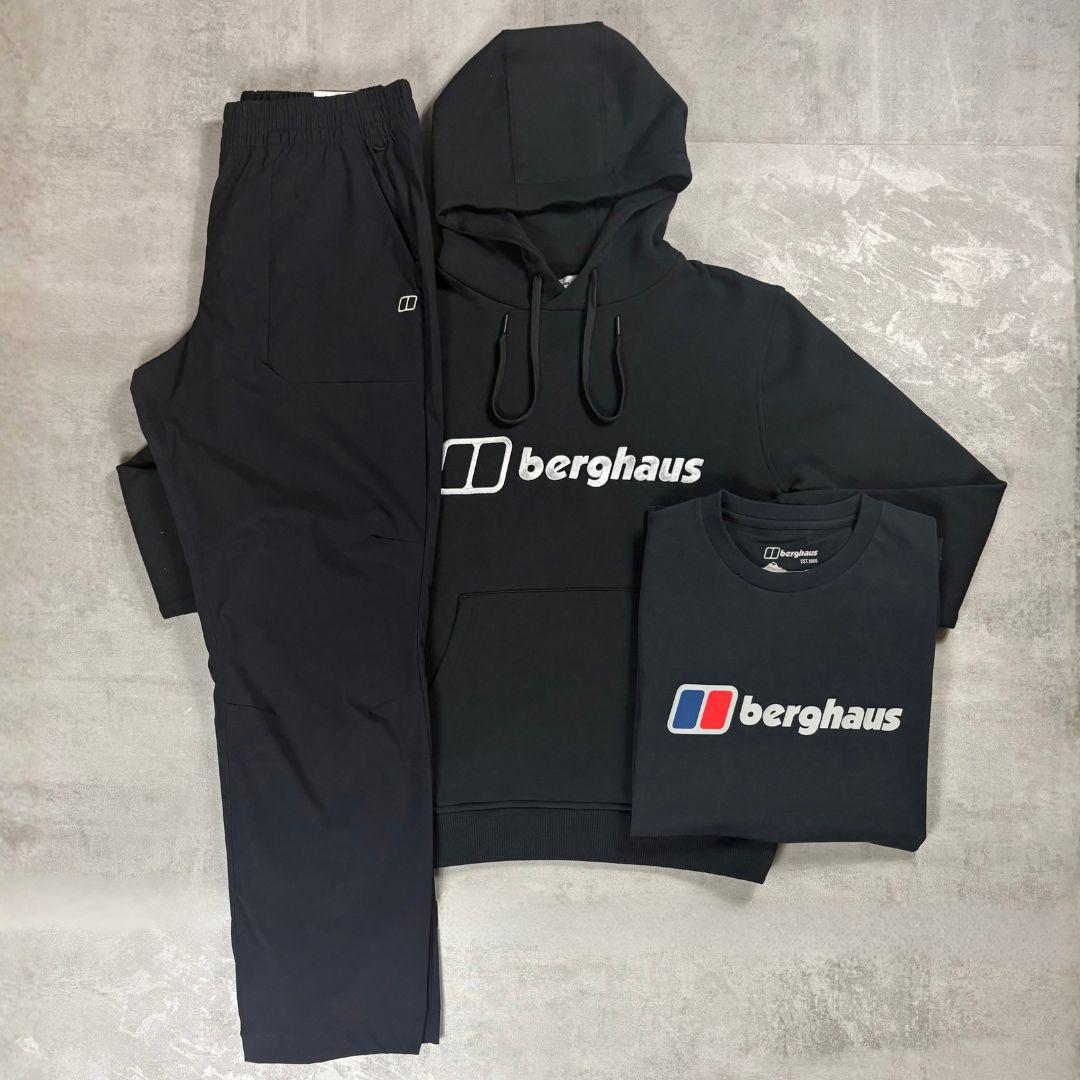 Berghaus Black Logo Hoodie, Tee & Pant Tracksuit for men, flat lay of black brushed fleece pullover hoodie with drawcord hood and Berghaus logo, black crewneck Berghaus logo t-shirt, and matching black joggers with elasticated waistband and patch pocket