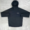 Black jacket with a Berghaus logo on a light gray background