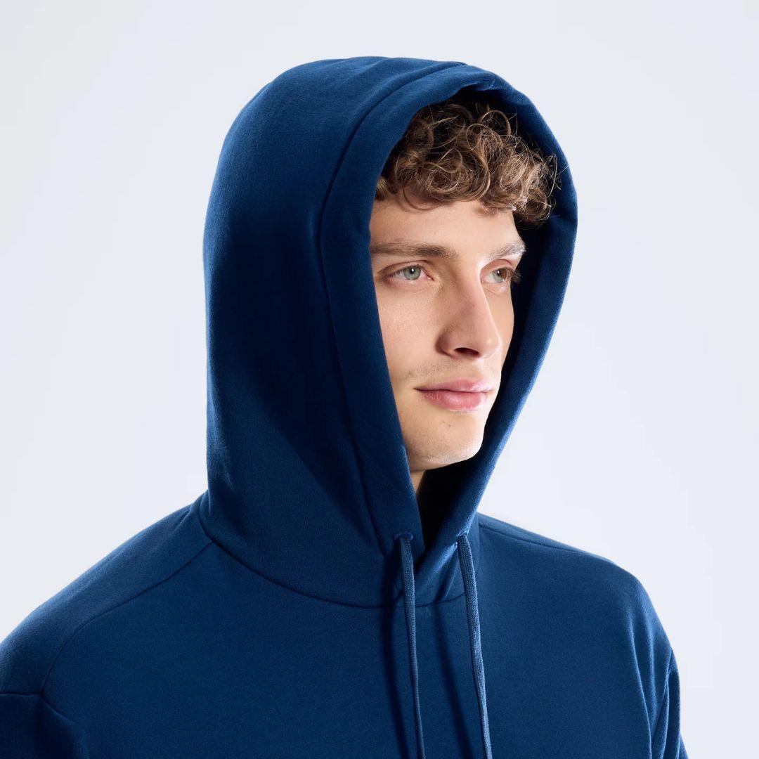 Berghaus 'Dark Blue' Logo Hoodie for men, close-up on model of the dark blue hoodie with the hood up and drawcords hanging at the chest