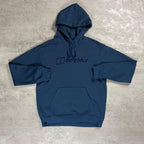 Berghaus 'Dark Blue' Logo Hoodie for men, flat lay on a grey concrete surface of the dark blue pullover hoodie with drawcord hood, kangaroo pocket and Berghaus logo