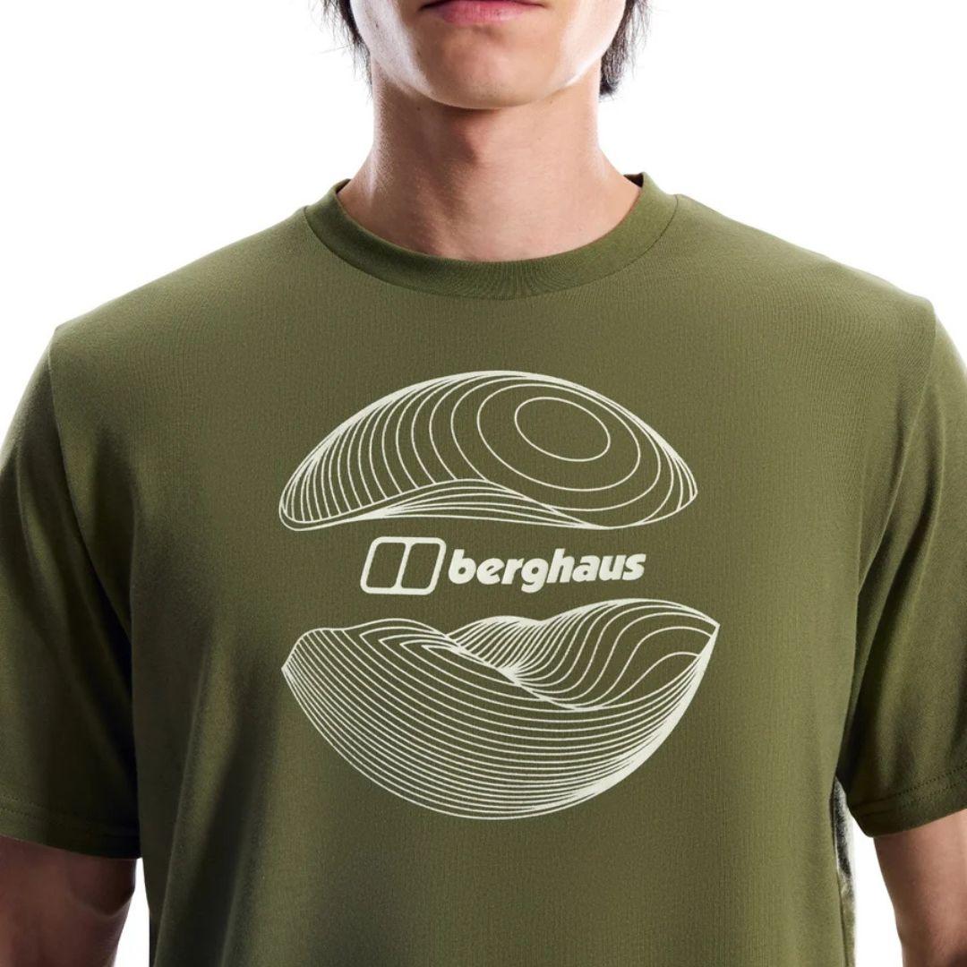 Berghaus 'Dark Green' Curvature Essential T-Shirt for men, close-up on model of the white contour-line graphic and Berghaus logo on the chest of the dark green tee