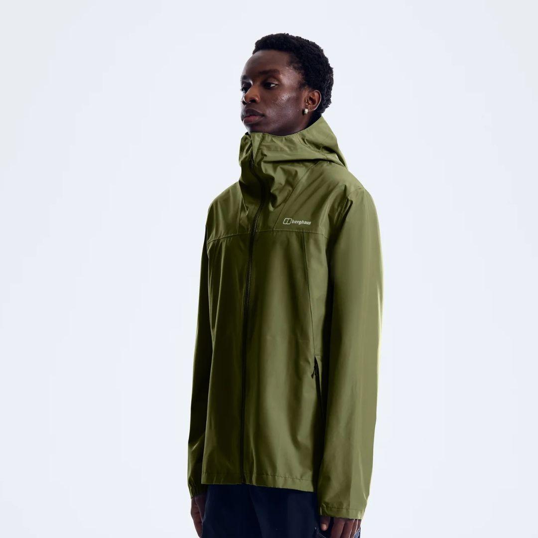 Berghaus 'Dark Green' Deluge Pro 3.0 Jacket for men, side view on model showing the hood and zipped hand pocket, part of the 'Dark Green' Deluge Pro 3.0 Jacket, Tee & Cargo Pant Tri-Set