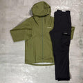 Berghaus 'Dark Green' Deluge Pro 3.0 Jacket & Cargo Pant Tracksuit for men, flat lay on a grey concrete surface of the dark green waterproof hooded jacket with matching black cargo pant