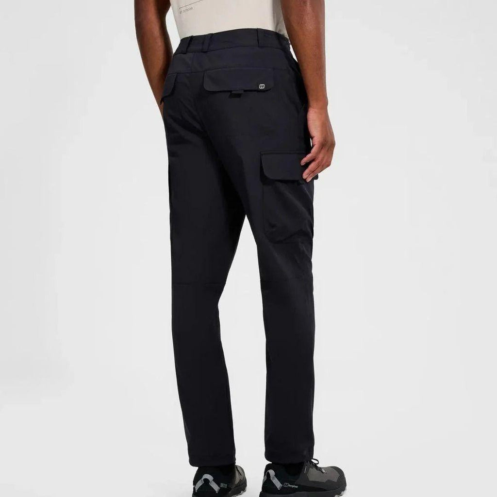 Berghaus Black Everyday Cargo Pant for men, back view on model showing the flap rear pocket and side thigh cargo pocket, part of the 'Dark Green' Deluge Pro 3.0 Jacket & Cargo Pant Tracksuit