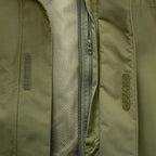 Berghaus 'Dark Green' Deluge Pro 3.0 Jacket for men, close-up of the front zip with storm flap and mesh lining on the dark green waterproof jacket