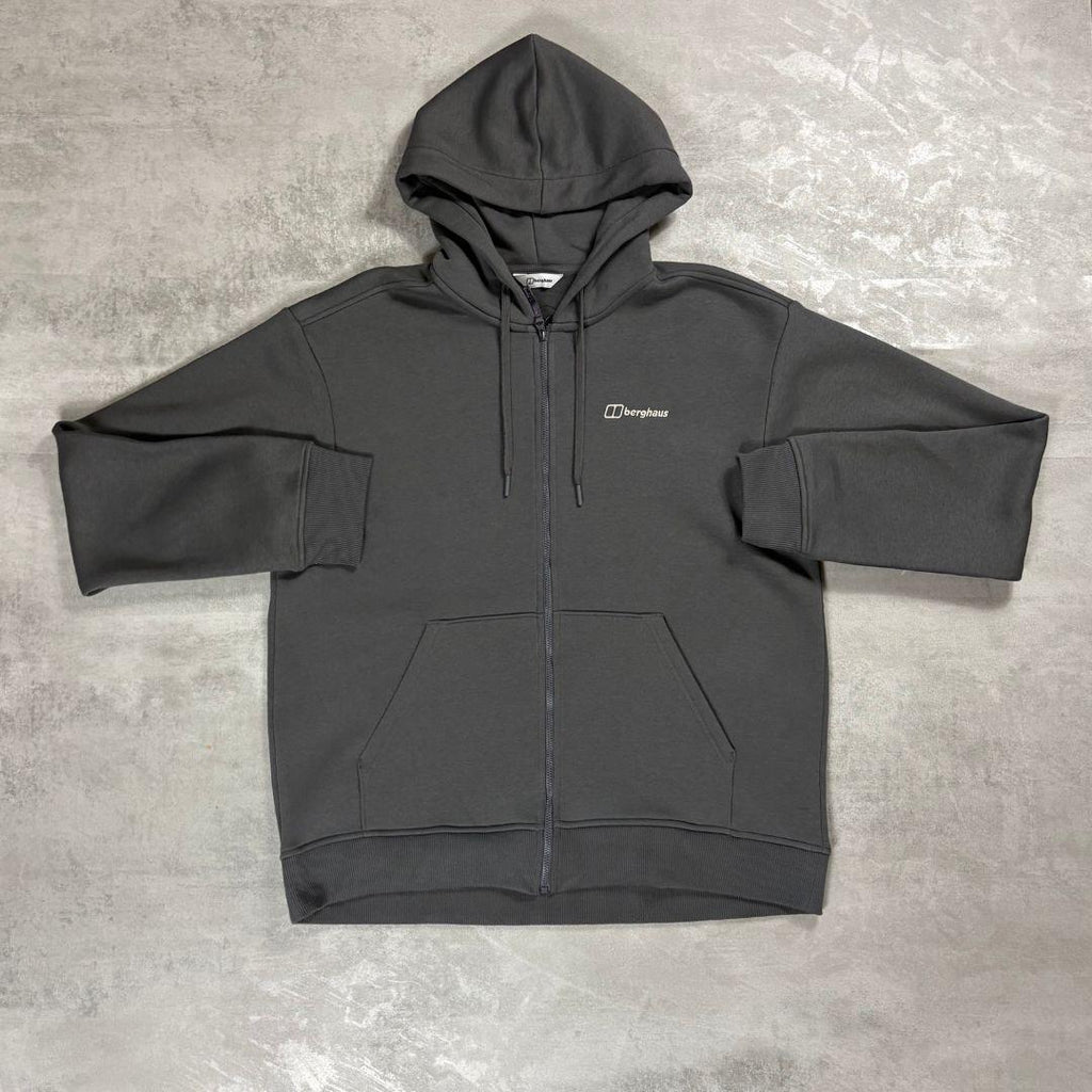 Berghaus 'Dark Grey' Logo Zip-Up Hoodie for men, flat lay on a grey concrete surface of the dark grey full-zip hoodie with hood, chest logo and front pockets