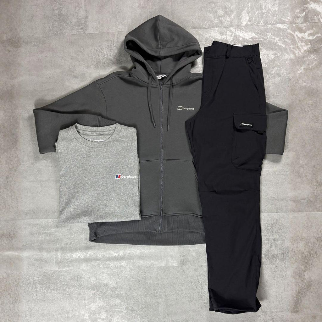 Berghaus 'Dark Grey' Logo Zip-Up Hoodie, Tee & Cargo Pant Tracksuit for men, flat lay on a grey concrete surface of the dark grey full-zip hoodie, grey marl logo tee and black cargo pant